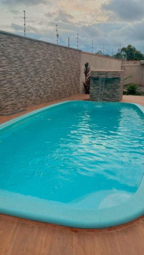 Casa com piscina pé na areia
